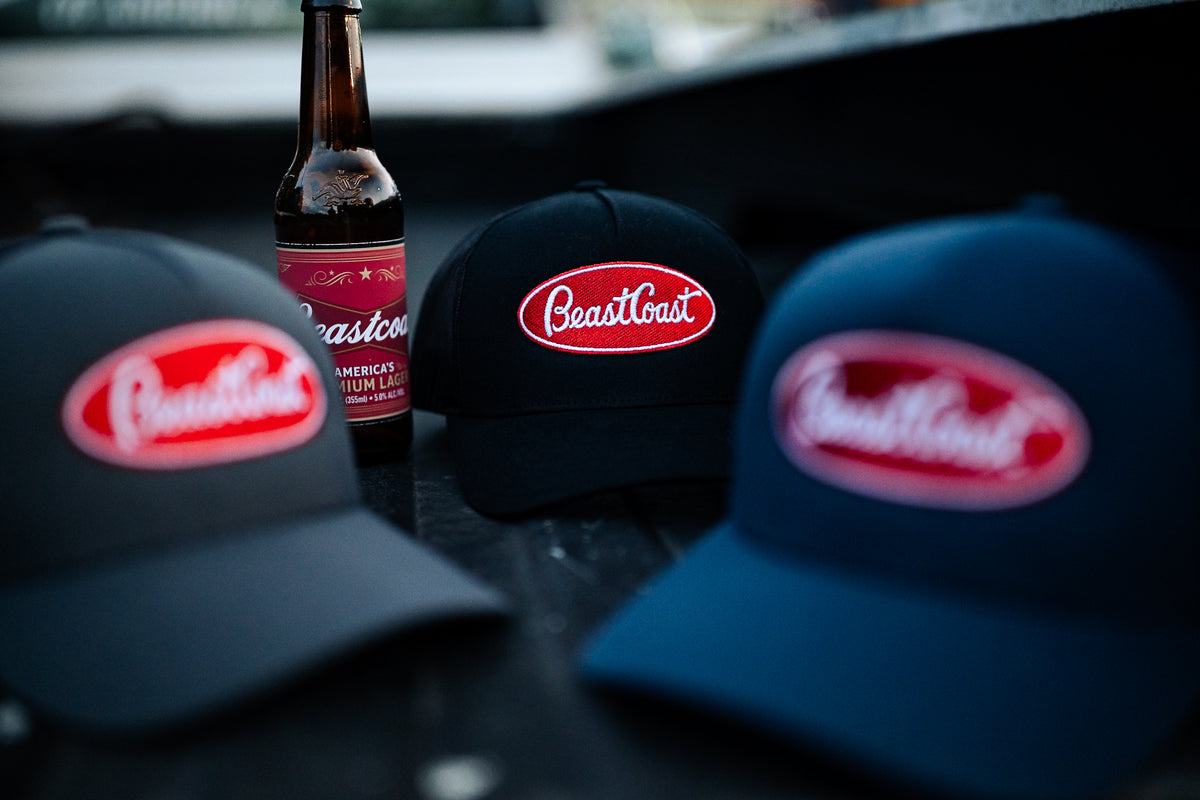 BeastCoast Americana Trucker hats in grey/black, black and navy, oval patch close-up