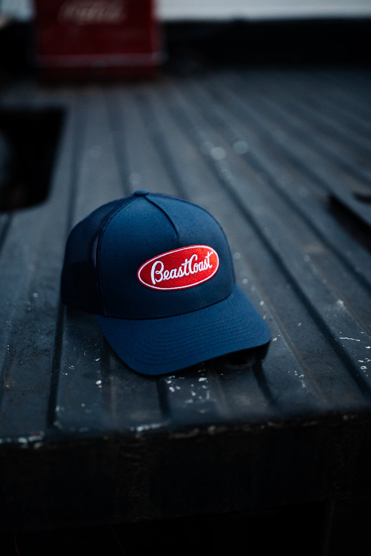 BeastCoast Americana Trucker hat in navy with red oval patch