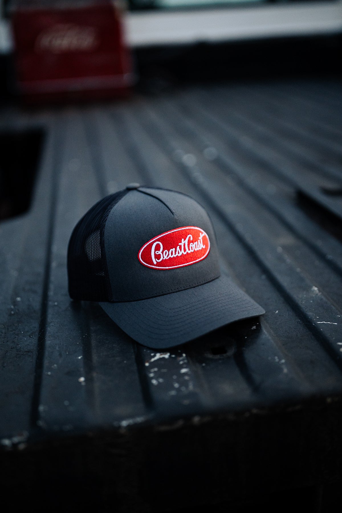 BeastCoast Americana Trucker hat in grey/black with red oval patch