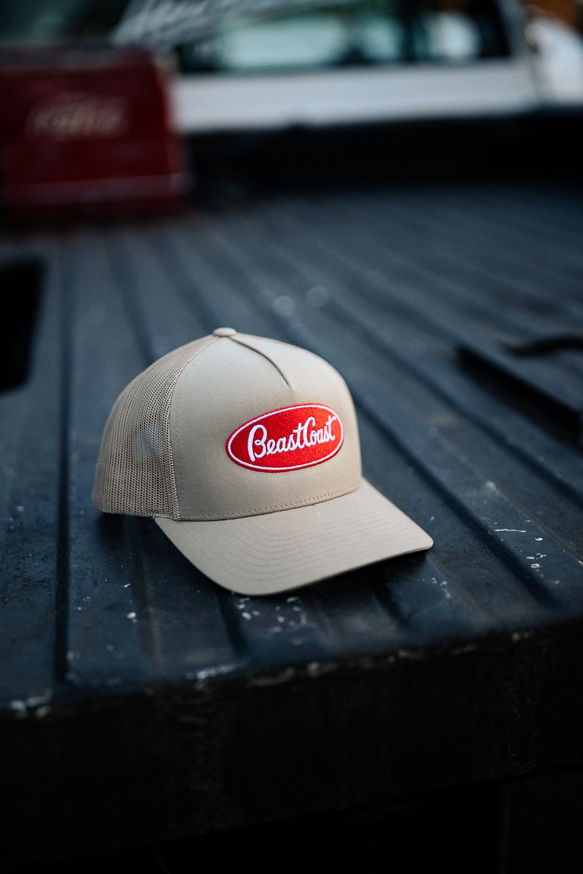 BeastCoast Americana Trucker hat in tan with red oval patch