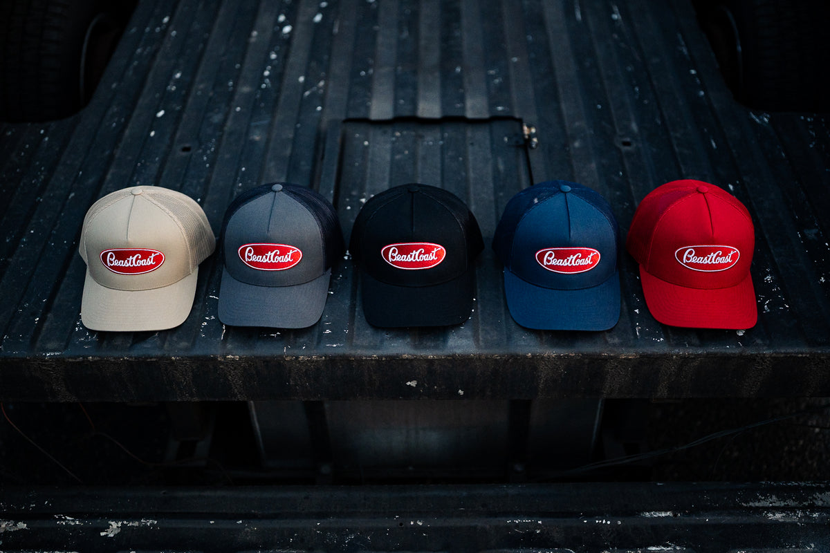 BeastCoast Americana Trucker hats lined up in tan, grey/black, black, navy and red