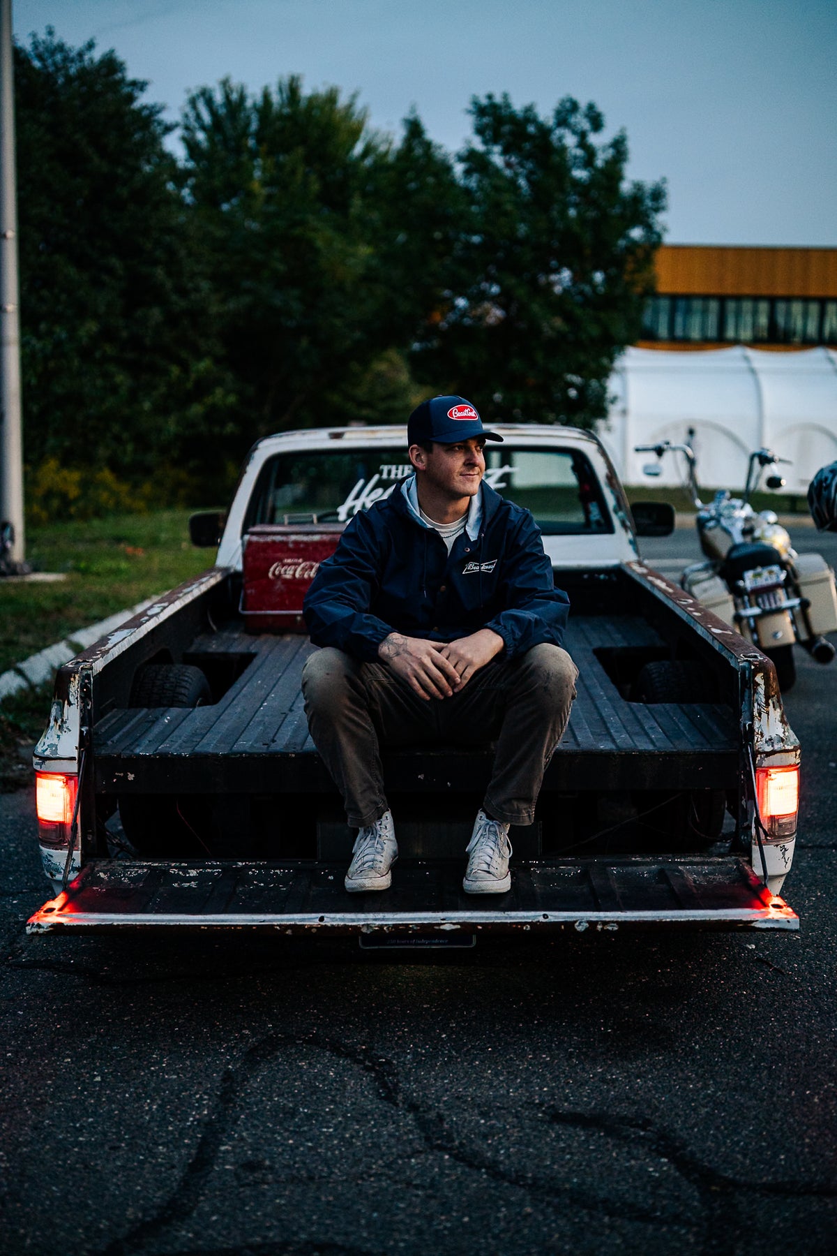 BeastCoast Americana Breaker jacket in navy, front view on pickup truck bed