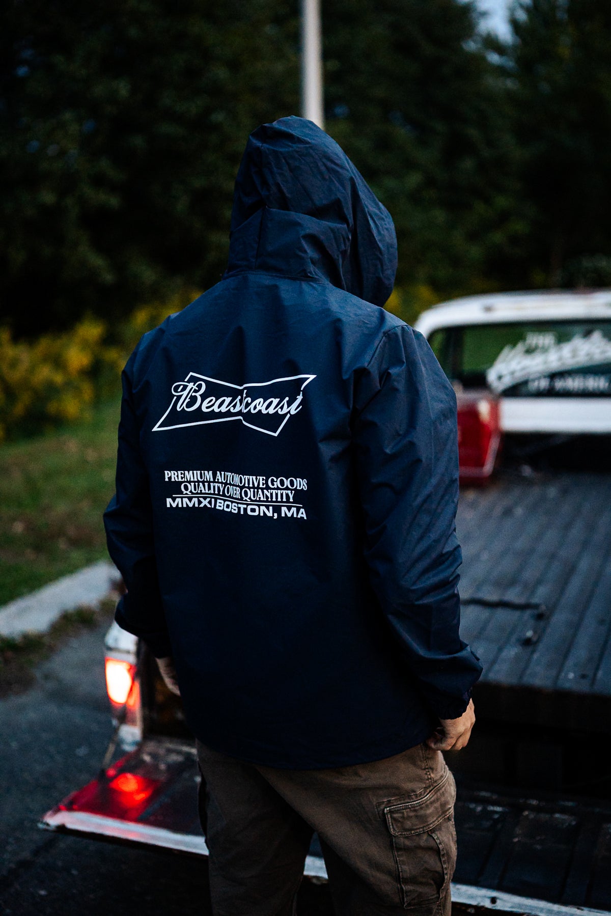 BeastCoast Americana Breaker jacket in navy, back view with hood up
