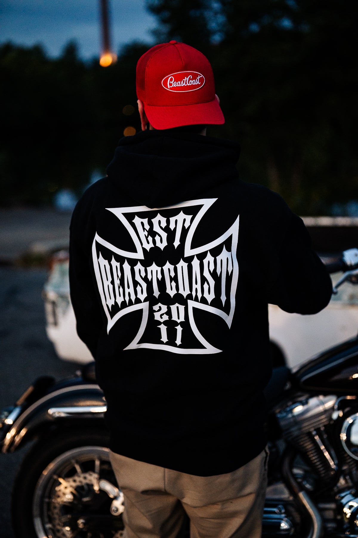 BeastCoast Americana Hoodie in black, back cross graphic by a motorcycle