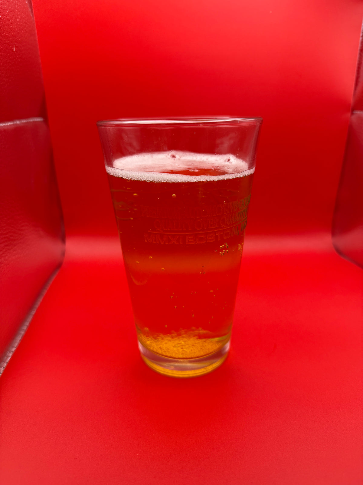 BeastCoast Americana Pint glass with beer on red background