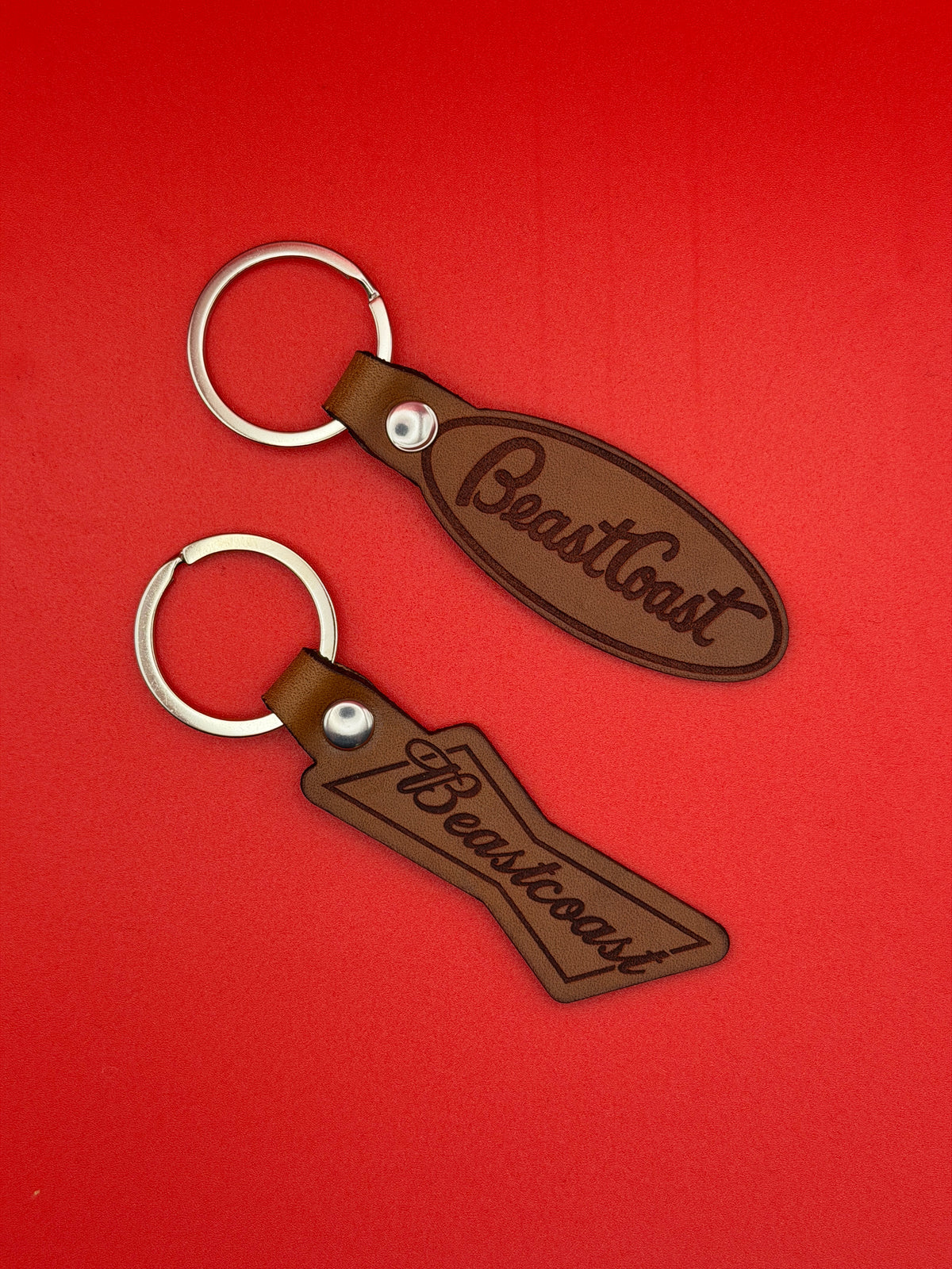 BeastCoast Americana Keychains in Pete oval and Bowtie shapes, brown leather